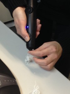 2013, New York, The US. This is not how to do it. Me trying out the 3Doodler. Photo credit: Erika Pursiainen, Innovation Unit, UNICEF NYHQ